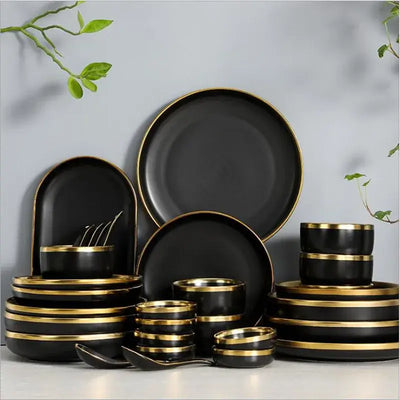 Elegant black porcelain plates with gold rim finish.
