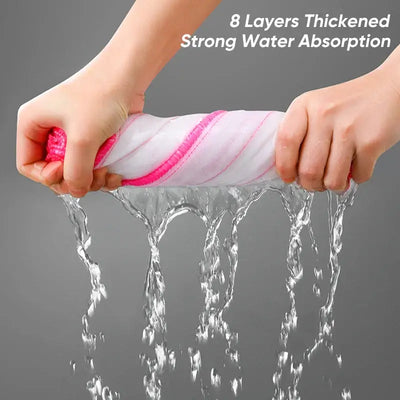 Hands squeezing a thickened dishcloth showcasing strong water absorption with flowing water.