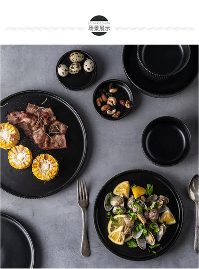 Elegant black porcelain plates with gold rim finish.