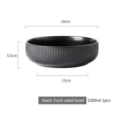 Elegant black porcelain plates with gold rim finish.