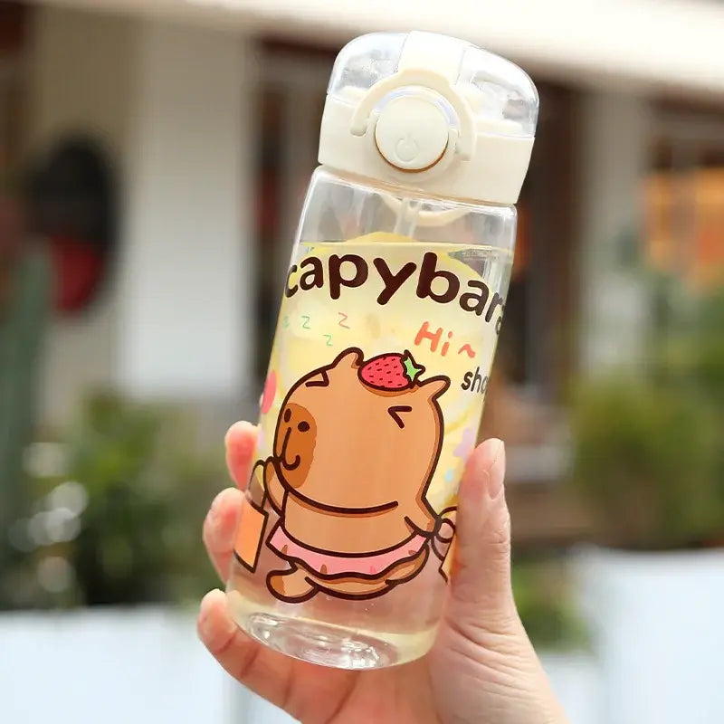 Stay hydrated in style! This 400ml Capibala cartoon cup comes with a secure lid and strap—perfect for kids on the go.