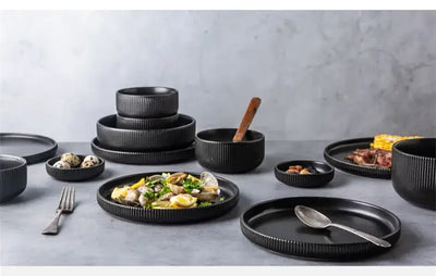Elegant black porcelain plates with gold rim finish.