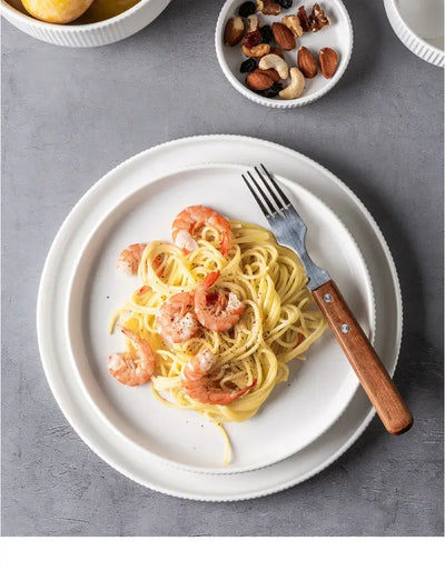 Elegant black porcelain plates with gold rim finish.