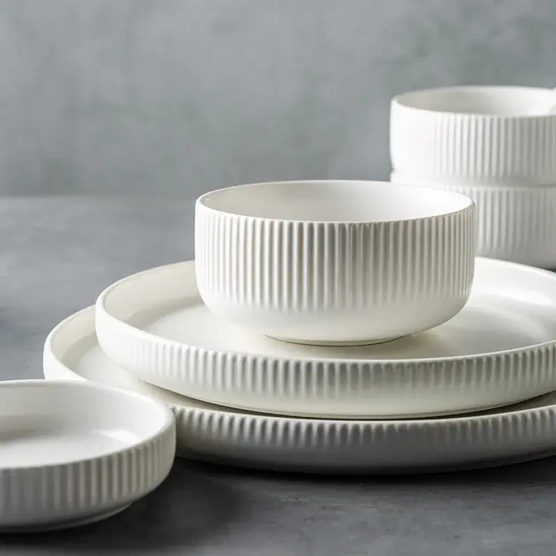 Elegant black porcelain plates with gold rim finish.