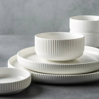 Elegant black porcelain plates with gold rim finish.