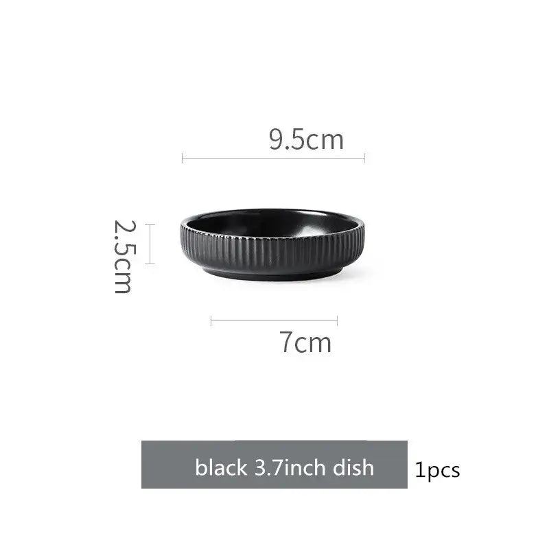 Elegant black porcelain plates with gold rim finish.