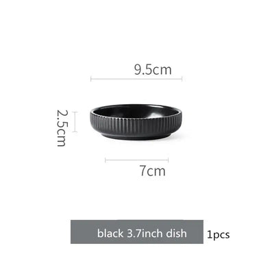 Elegant black porcelain plates with gold rim finish.