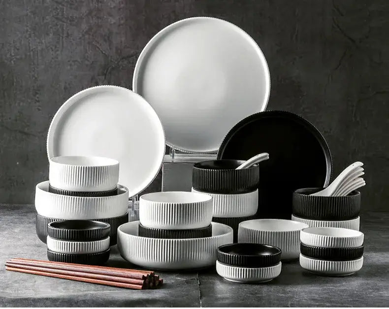 Elegant black porcelain plates with gold rim finish.