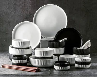 Elegant black porcelain plates with gold rim finish.