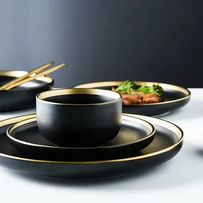 Elegant black porcelain plates with gold rim finish.