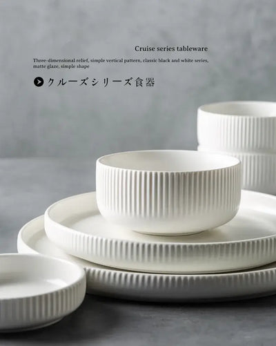 Elegant black porcelain plates with gold rim finish.