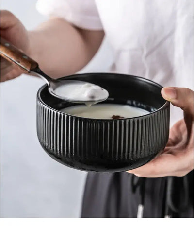 Elegant black porcelain plates with gold rim finish.