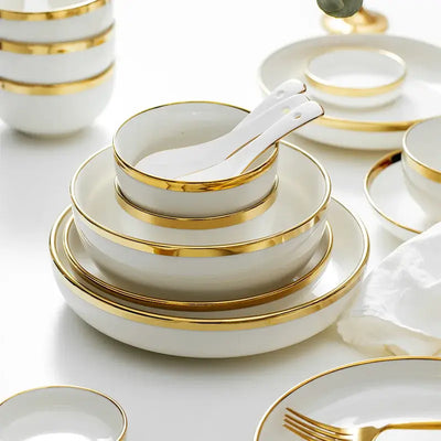 Elegant black porcelain plates with gold rim finish.